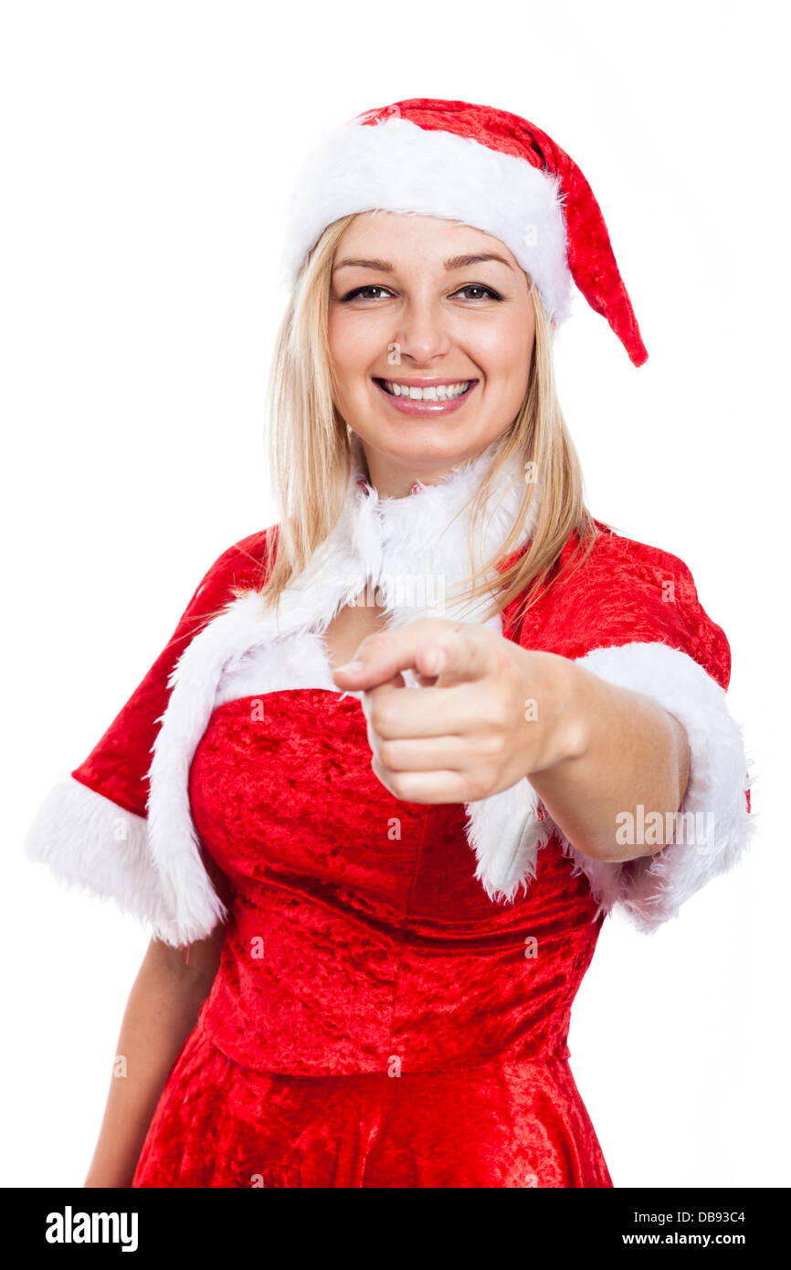 Happy woman in Christmas costume pointing at you, isolated on white background. Stock Photo
