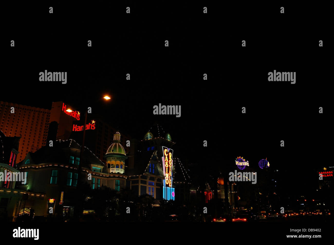 Oblique night view, looking south, traffic, electric lights green windows Casino Royale, Harrah's Hotel Casino, Las Vegas Strip Stock Photo
