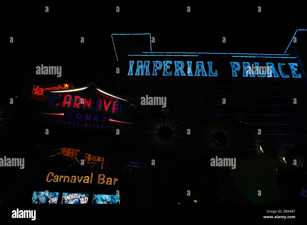Night neon view yellow Carnaval Bar, red Carnaval Court signs, in front