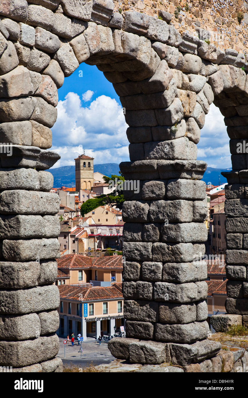 The town of Segovia, Spain, seen through the arches of a Roman aqueduct Stock Photo
