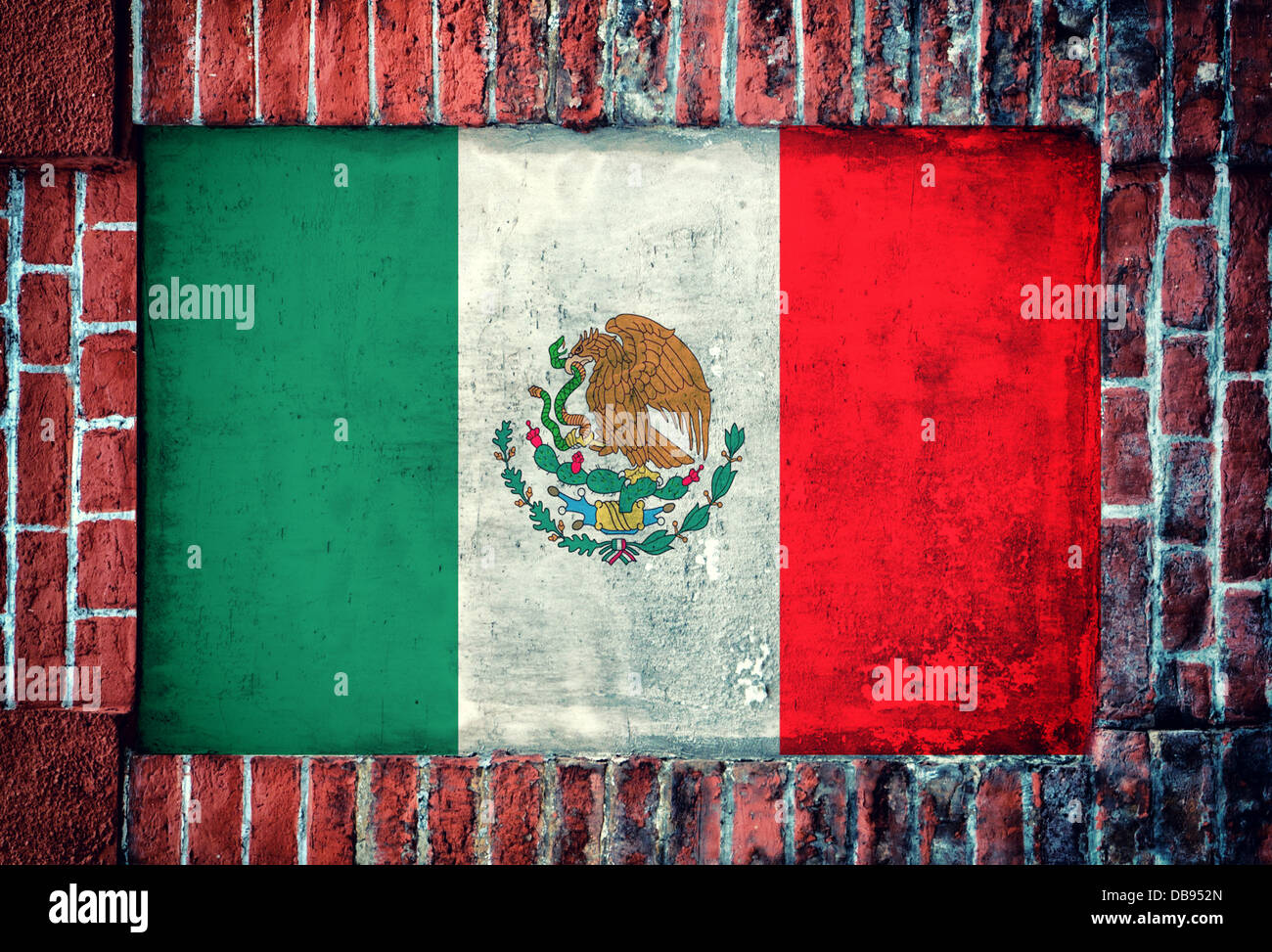 Mexican flag in the old bricks wall Stock Photo