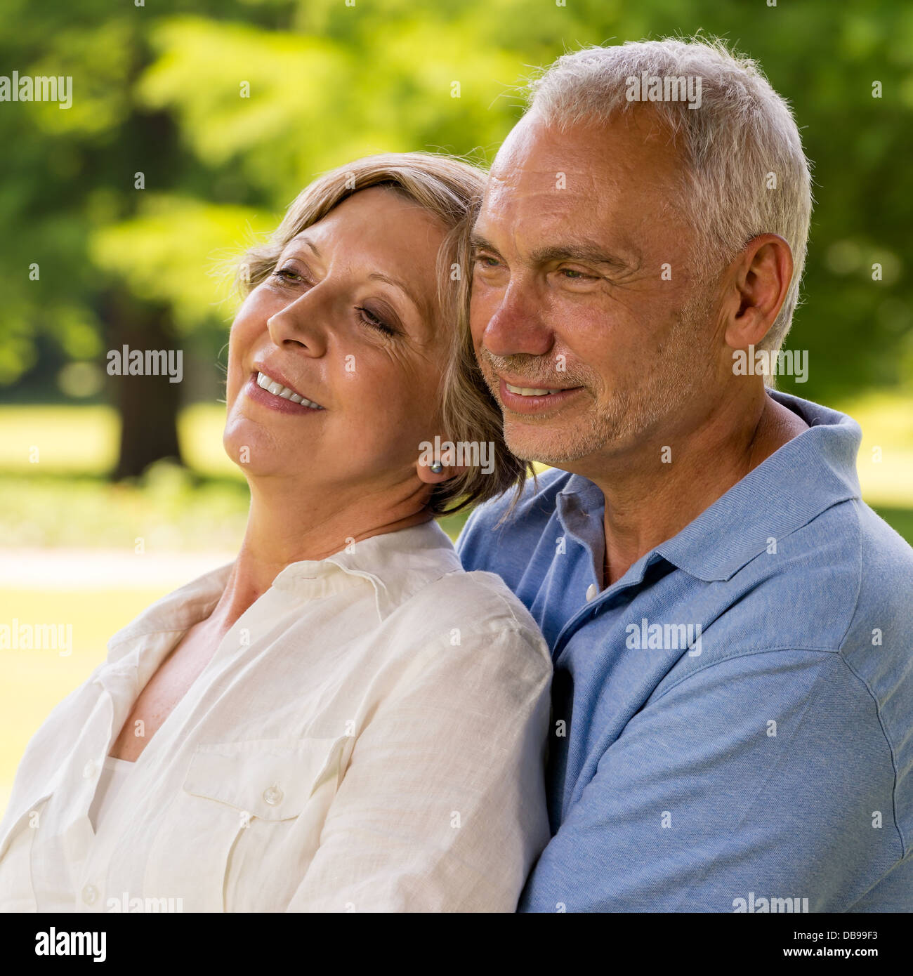 Senior Caucasian couple embracing in nature Stock Photo - Alamy