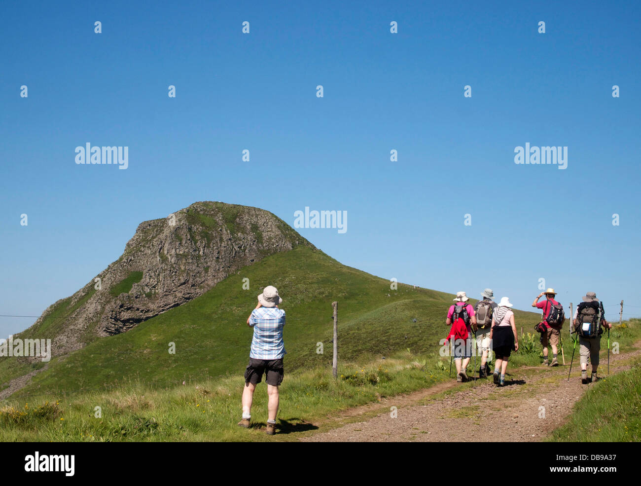 Ramblers walking in  countryside in Banne d'Ordanche, Auvergne, France. Stock Photo