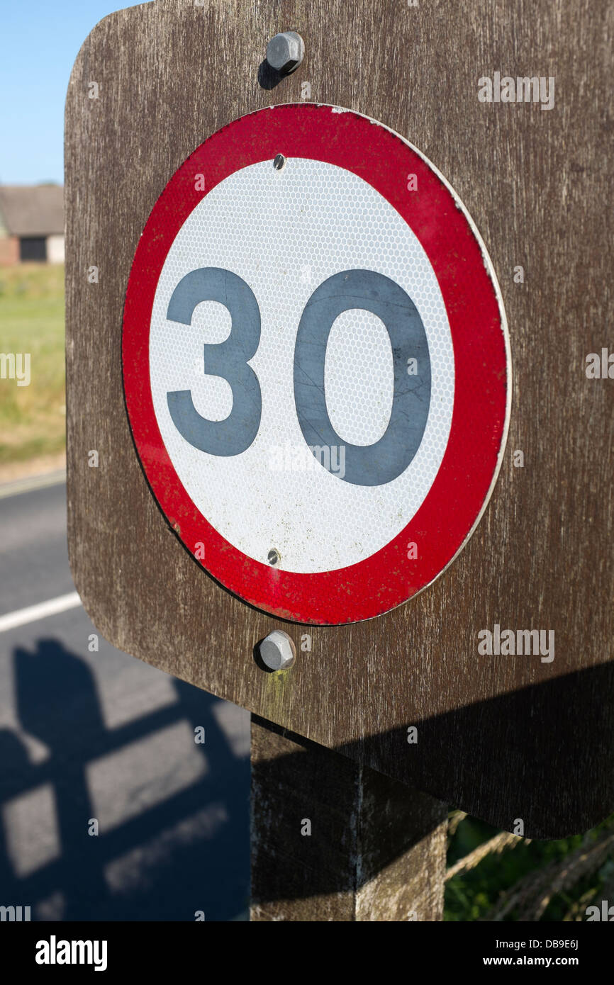 30 mile per hour mph sign on road through avebury Stock Photo
