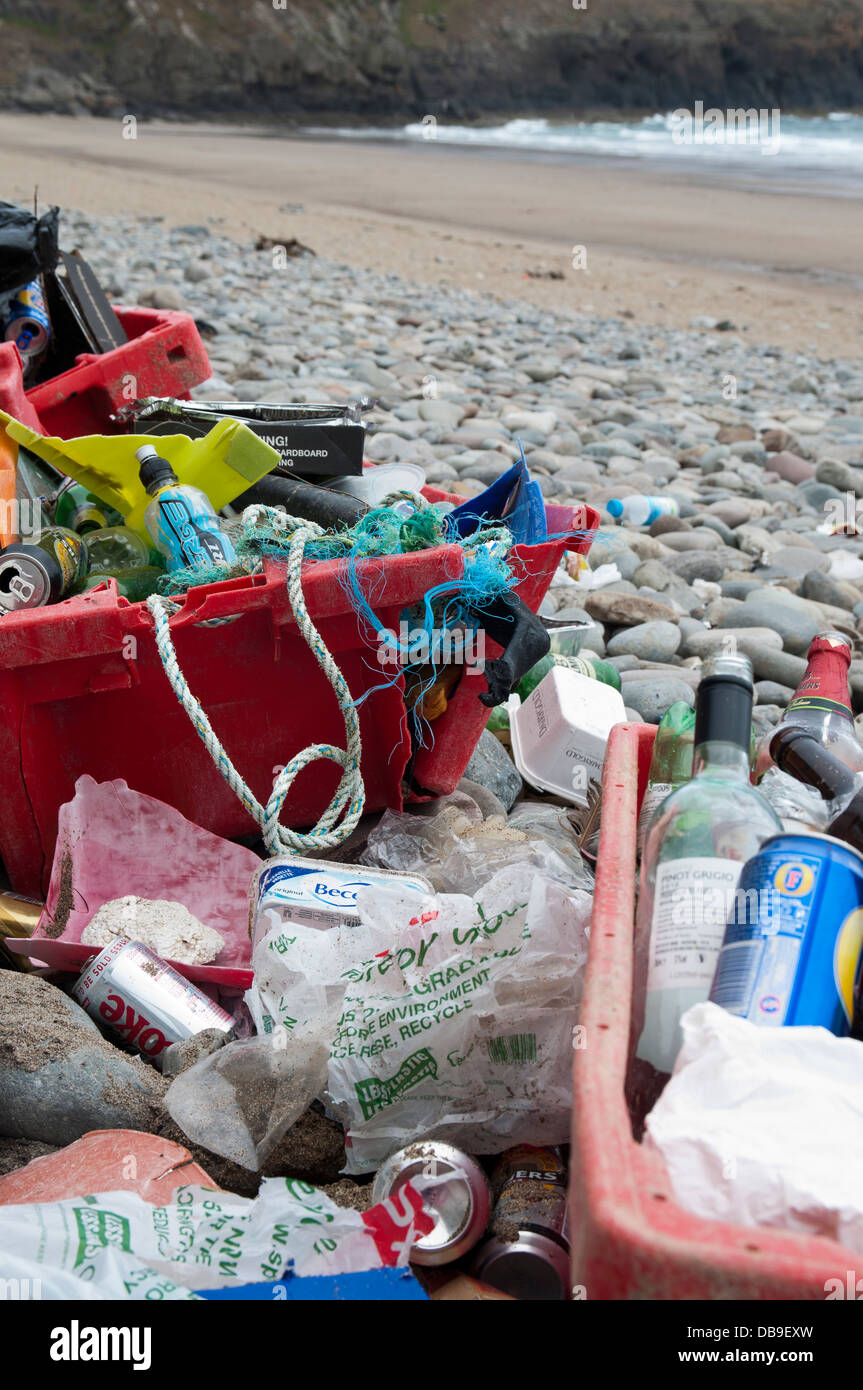 Beach litter washed up on the shore at Porth Ceiriad on the Lleyn Peninsula North Wales Stock Photo