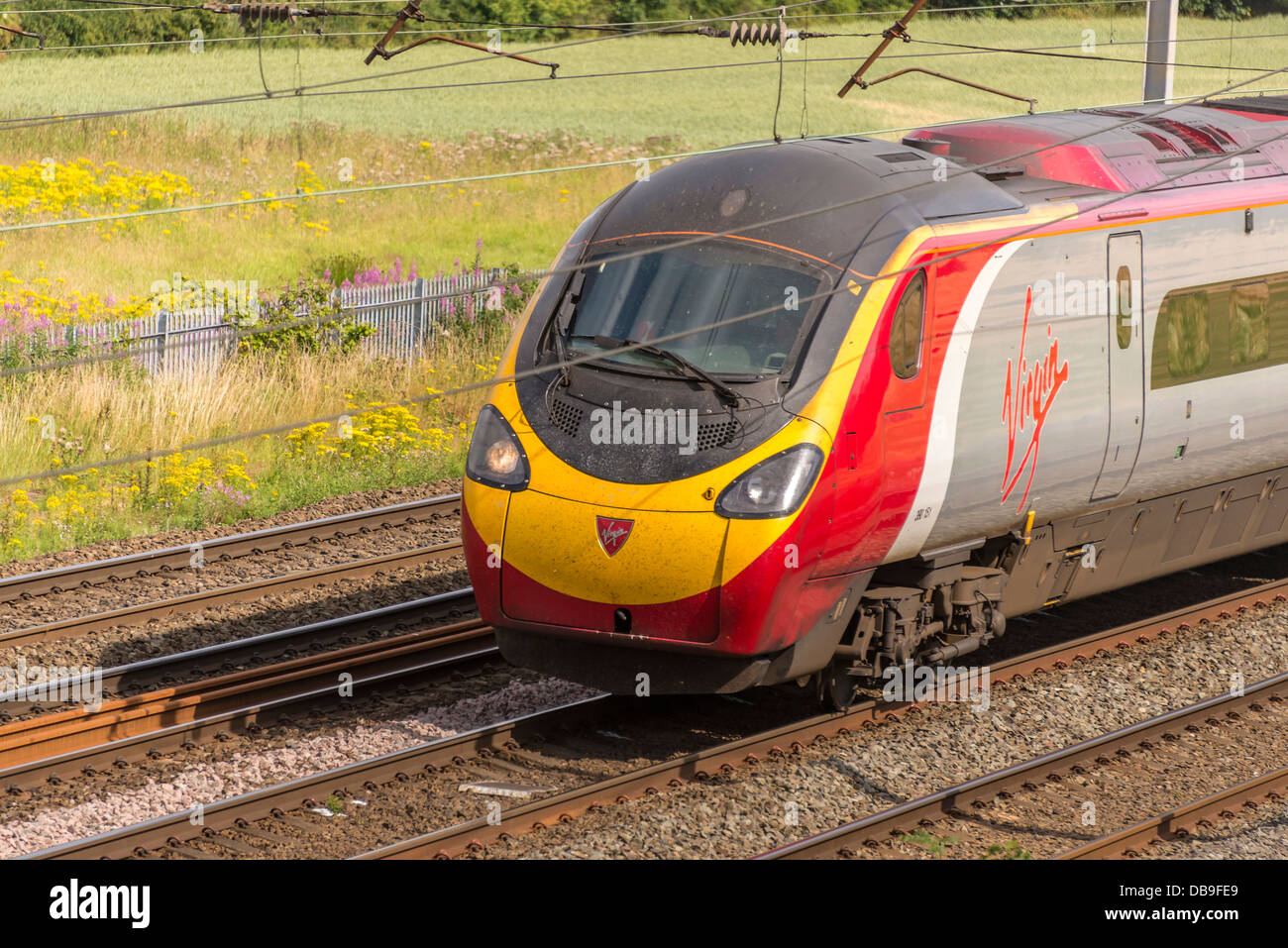 Virgin trains high speed Pendolino at Winwick junction on the West Coast main line. WCML. Stock Photo