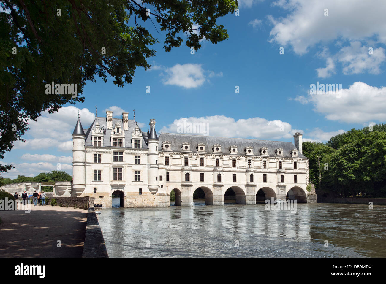 A landscape view of Château Chenonceau in the Loire valley, France showing the  main building spanning the river Stock Photo