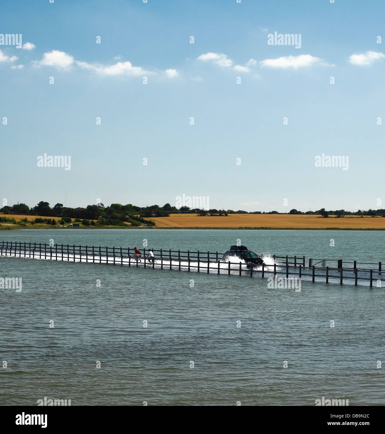 The Strood Causeway. The only road connecting Island of Mersea to the mainland which is flooding during a spring tide. Stock Photo