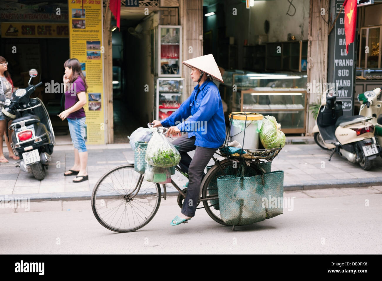 Hanoi, Vietnam - street vendor on a bicycle in the Old Quarter Stock Photo