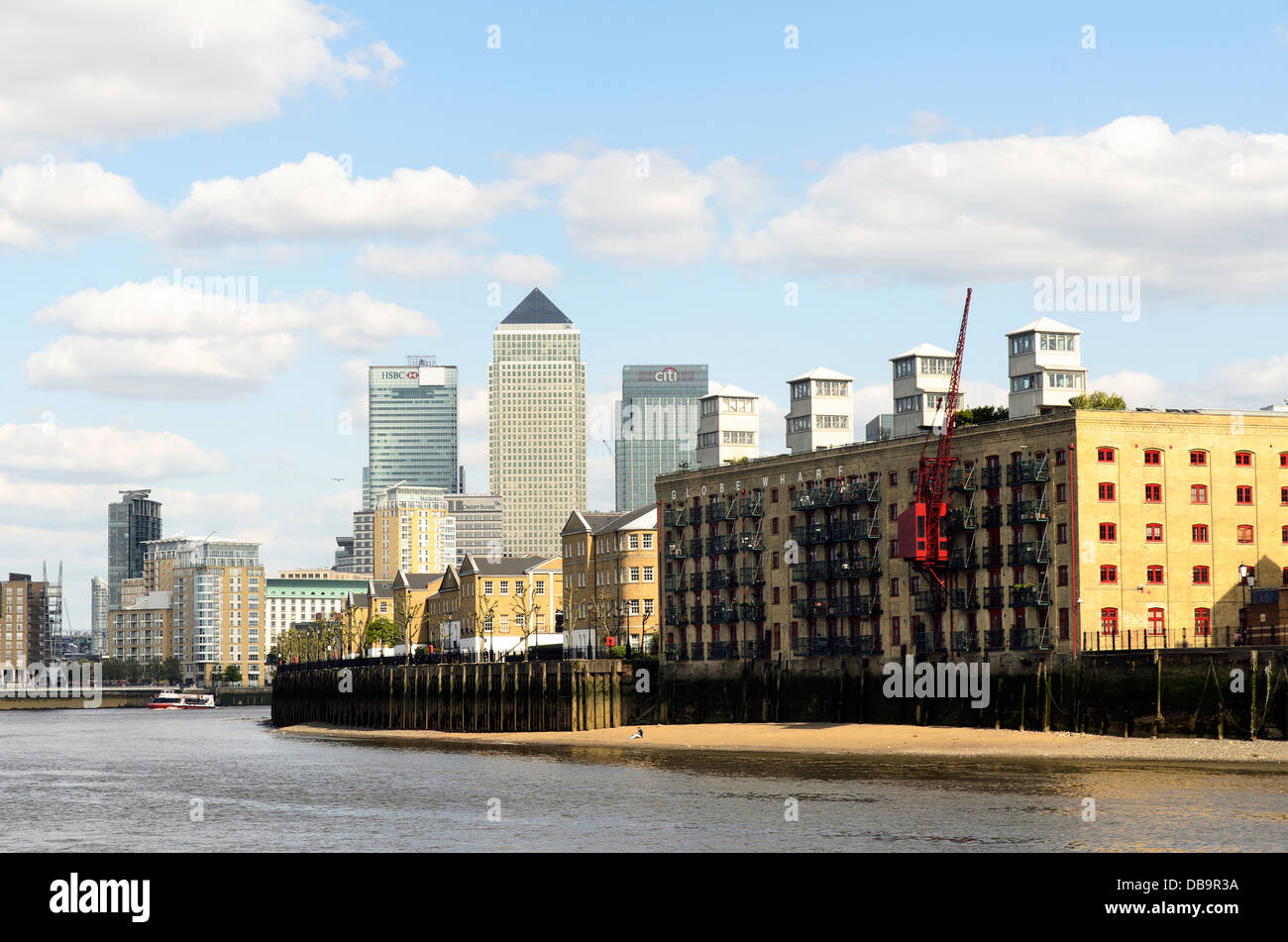 Canary Wharf from River Thames with Globe Wharf apartments in Rotherhithe street  in foreground - London Stock Photo