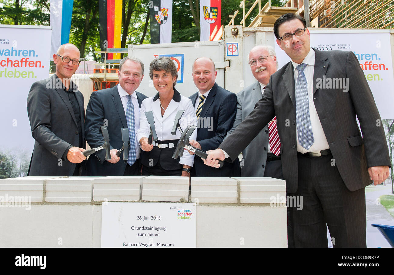 Architect Per Pedersen (L-R), Bavaria's Minister for Science, Research and Art Wolfgang Heubisch, Lord Mayor of Bayreuth Brigitte Merk-Erbe, parliamentary secretary of state Hartmut Koschyk, foundation chairman and president of the governmental region of Upper Franconia Wilhelm Wenning and museum director Sven Friedrich atand during the cornerstone laying ceremony for the new Richard Wagner Museum in Bayreuth, Germany, 26 July 2013. The date of the opening hasn't been set yet. Photo: MARC MUELLER Stock Photo