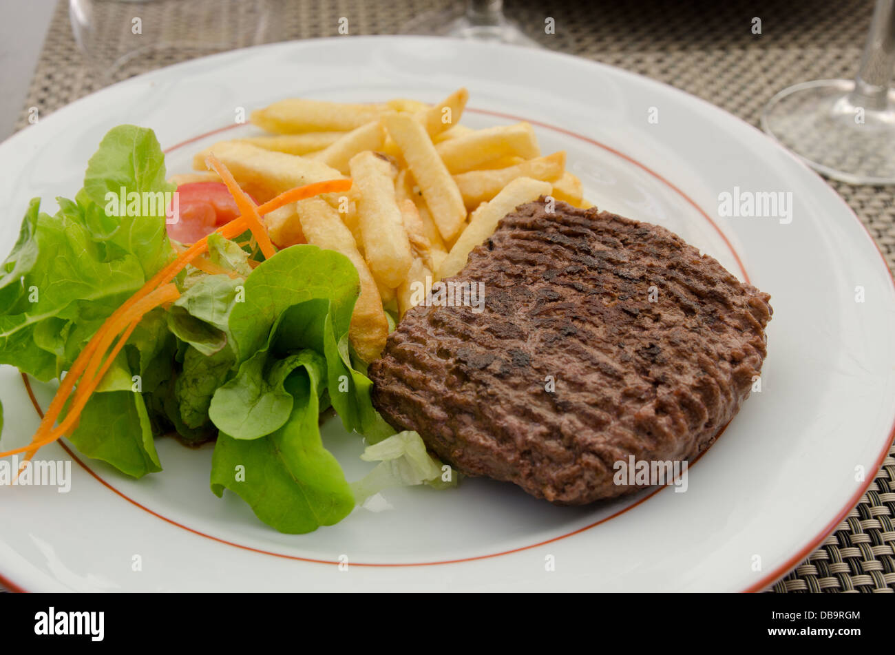A meal of burger, chips and salad Stock Photo Alamy