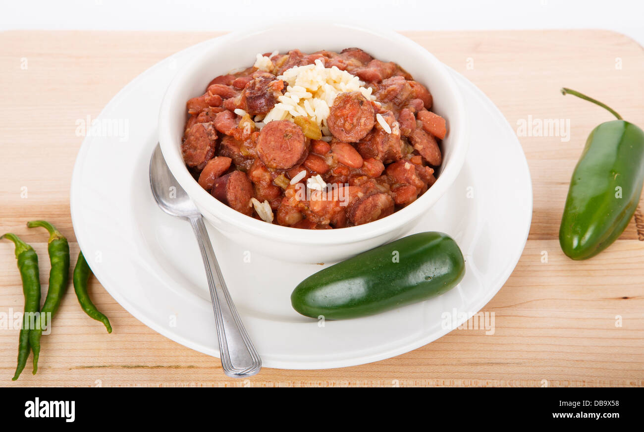 A bowl of red beans and rice with spicy, green jalapeno peppers Stock