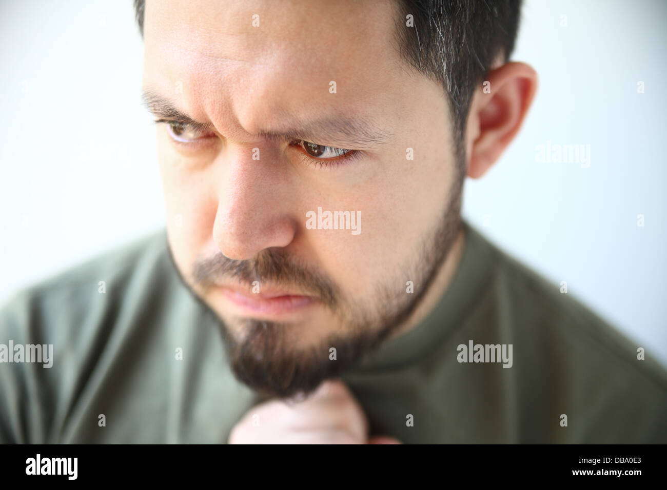 young man with heartburn feels nausea and other heartburn symptoms