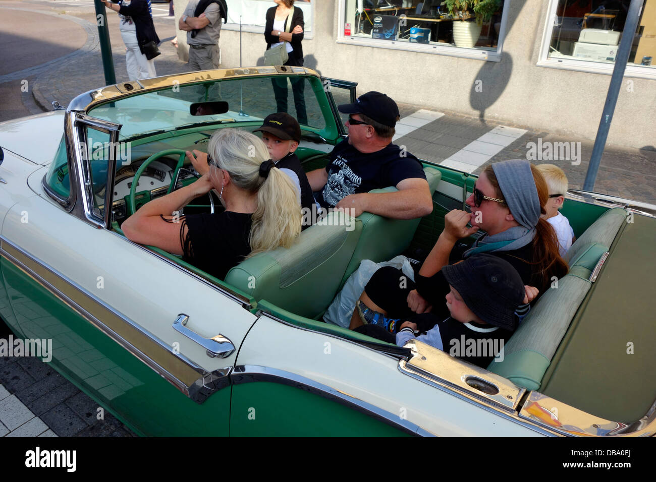 Middle Aged Woman Drives A Classic Convertible Car With Adults And Children As Passengers On The Road In Varberg Town Sweden Stock Photo Alamy