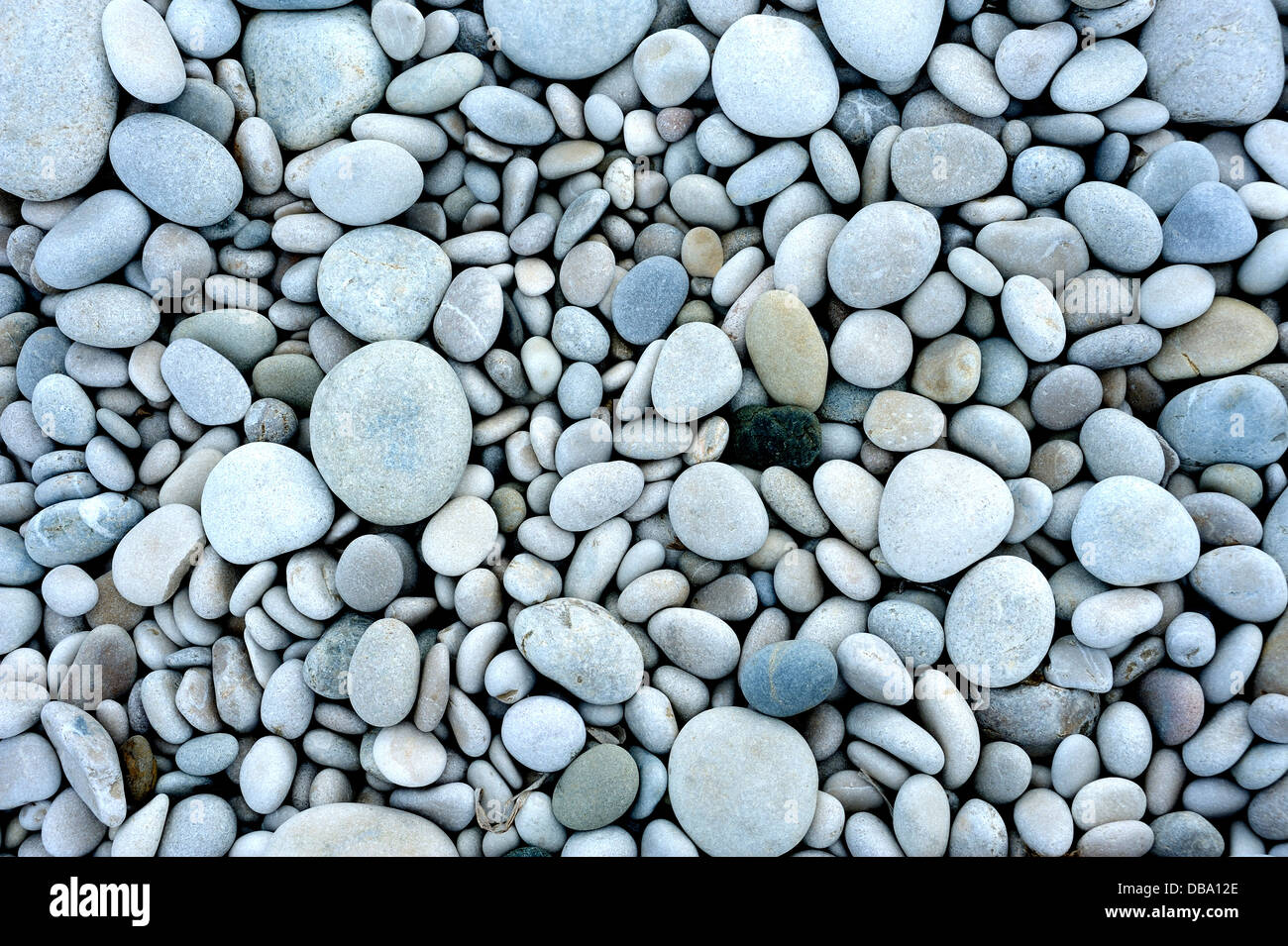 PEBBLES OR SMALL STONES ON A BEACH Stock Photo