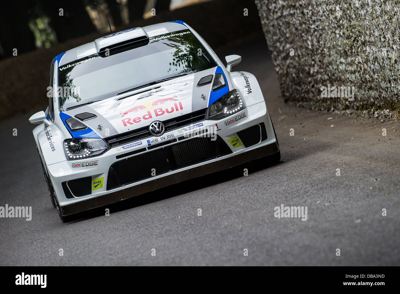 Chichester, UK - July 2013: Volkswagen Polo WRC passes the flint wall in action at the Goodwood Festival of Speed on July 12, 20 Stock Photo
