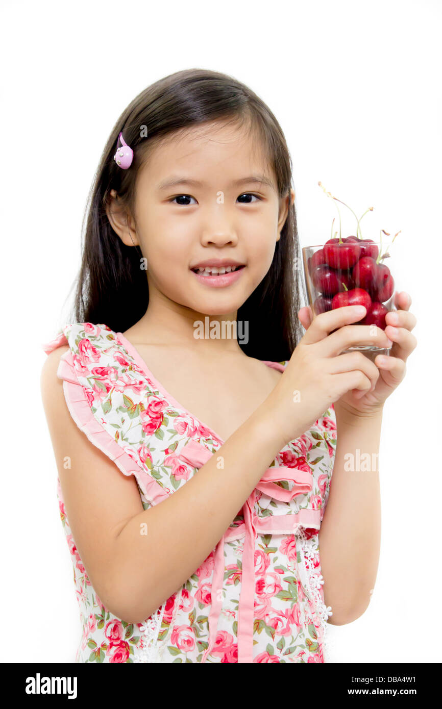 Little asian girl with fresh red cherry Stock Photo Alamy