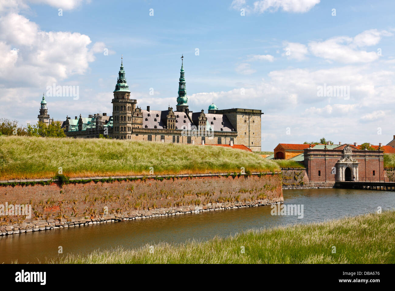 The renaissance castle Kronborg in Elsinore, Denmark, with the main entrance and the protecting moat in the foreground. Stock Photo