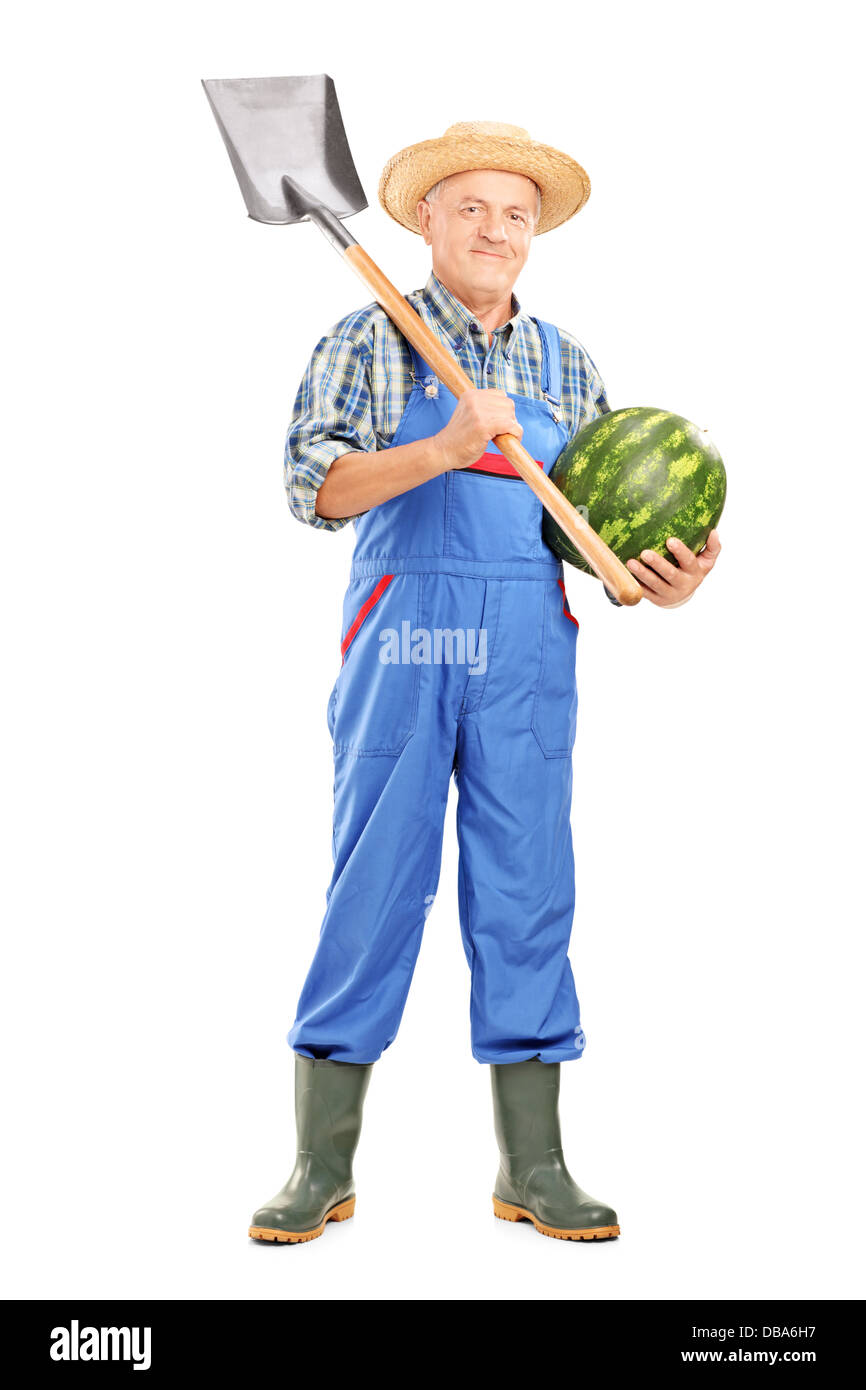 Full length portrait of a smiling farmer holding a watermelon and ...