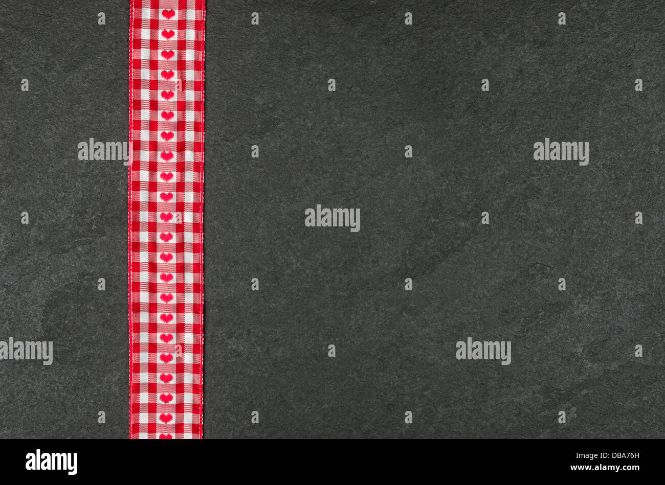 Slate plate with checkered ribbon Stock Photo