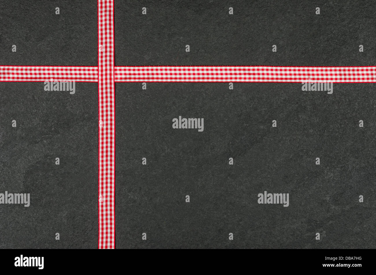 Slate plate with checkered ribbons Stock Photo