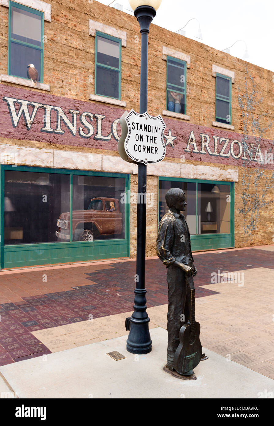 Statue and mural in 'Standin' On The Corner Park' on old Route 66 in Winslow, Arizona, USA Stock Photo