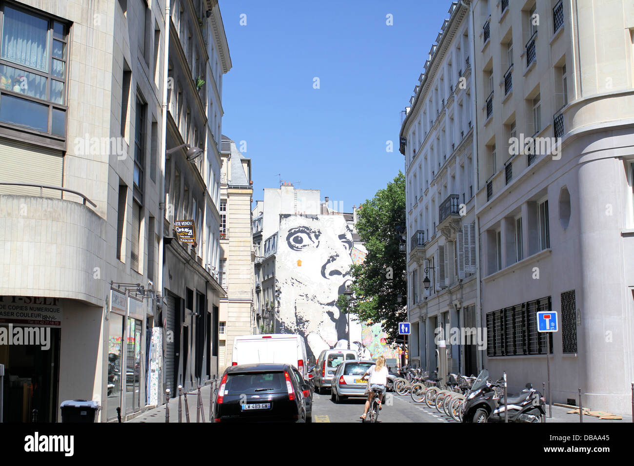 A view westwards down Rue du Cloitre Saint-Merri, looking at a large mural on a building Stock Photo