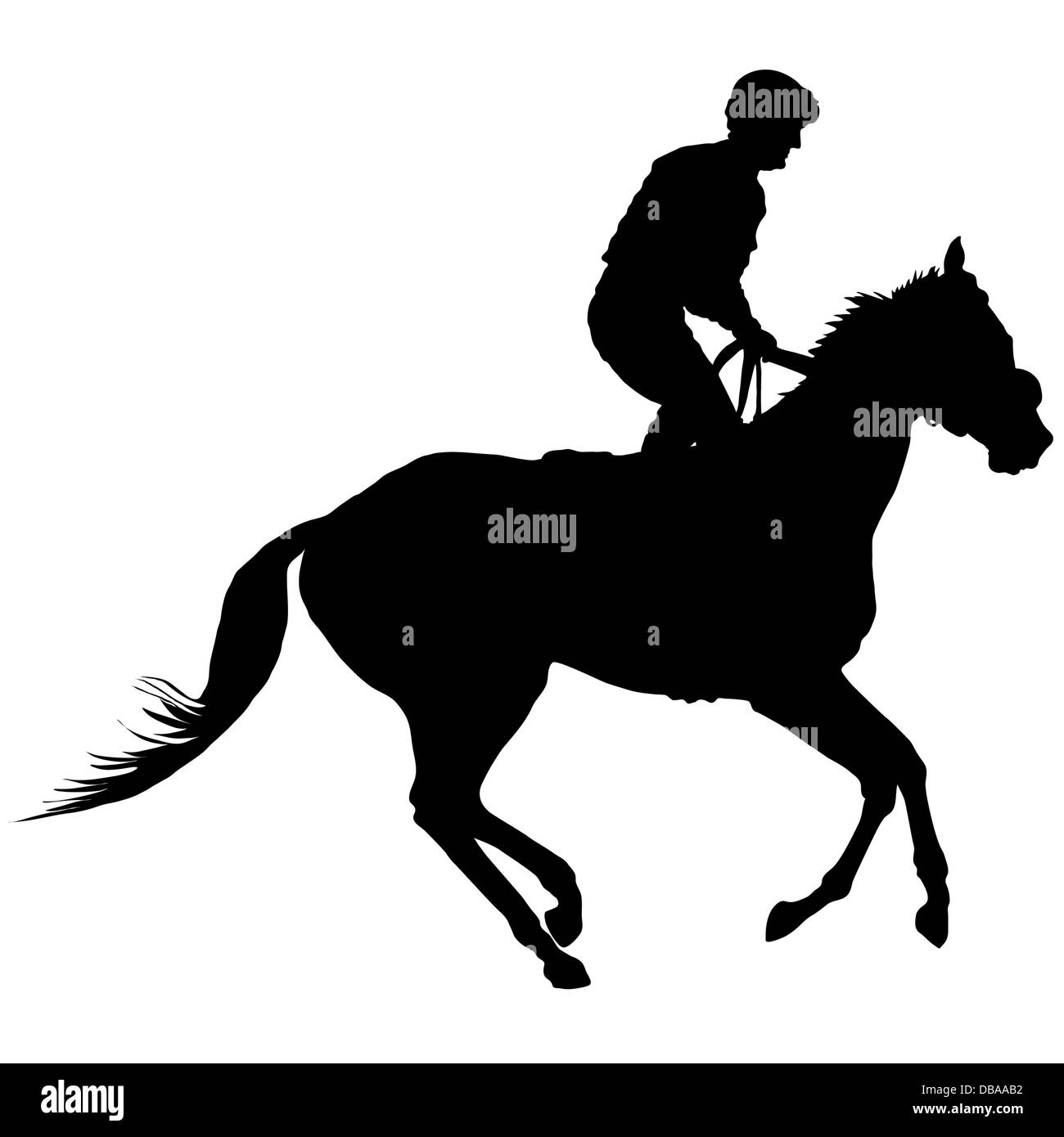 Silhouette of a jockey exercising his horse. Stock Photo