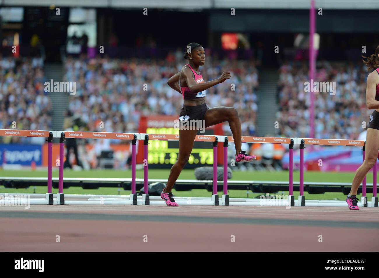 Perry Shakes-Drayton runs a personal best in the women's 400m hurdles at the 2013 Anniversary Games in the Queen Elizabeth Olympic stadium, London Stock Photo