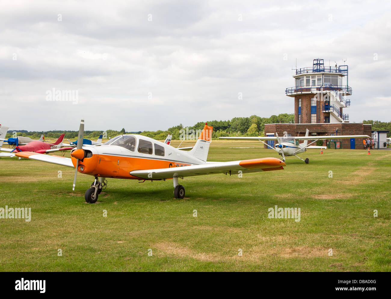 Light aircraft and control tower at City Airport formerly Barton Aerodrome in Eccles, Manchester. Stock Photo