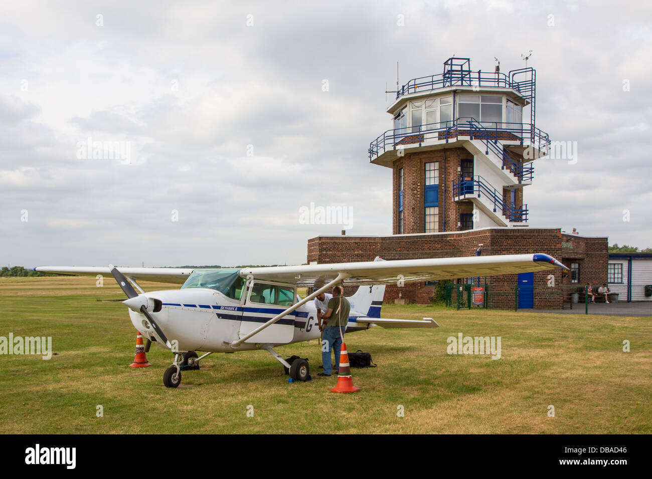 Cessna light aircraft and control tower at City Airport formerly Barton Aerodrome in Eccles, Manchester. Stock Photo