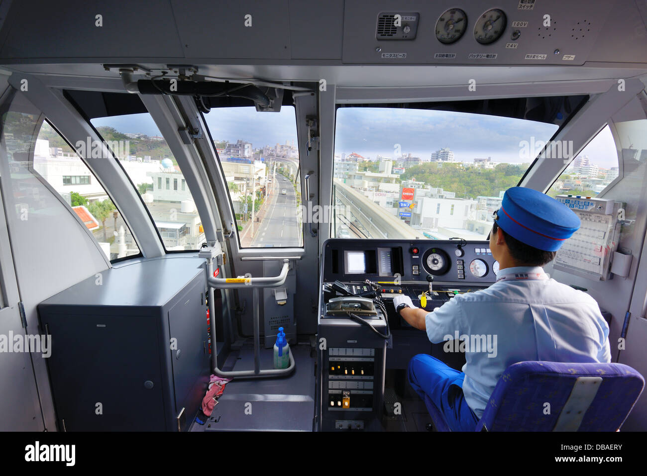 A conductor drives the Yui Monorail in Naha, Okinawa, Japan. Stock Photo