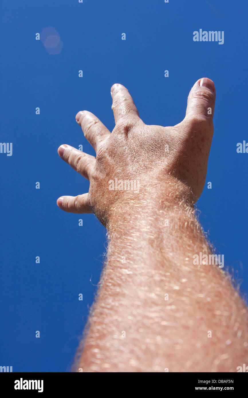 Hand reaching to sky hi-res stock photography and images - Alamy