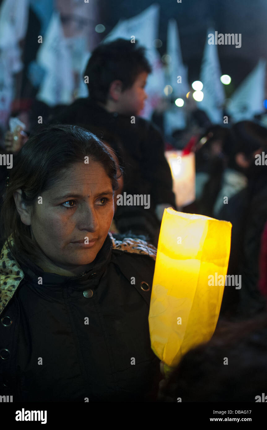 Buenos Aires, Buenos Aires, Argentina. 26th July, 2013. Slumdwellers march with torches from the Obelisco to the Plaza de Mayo as the Second Slumdwellers Congress starts. The demonstrators demand the City and Federal governments solutions to housing problems. Nearly 200.000 people live in slums that lack drinking water, sanitation, gas and other services. Credit:  Patricio Murphy/ZUMAPRESS.com/Alamy Live News Stock Photo