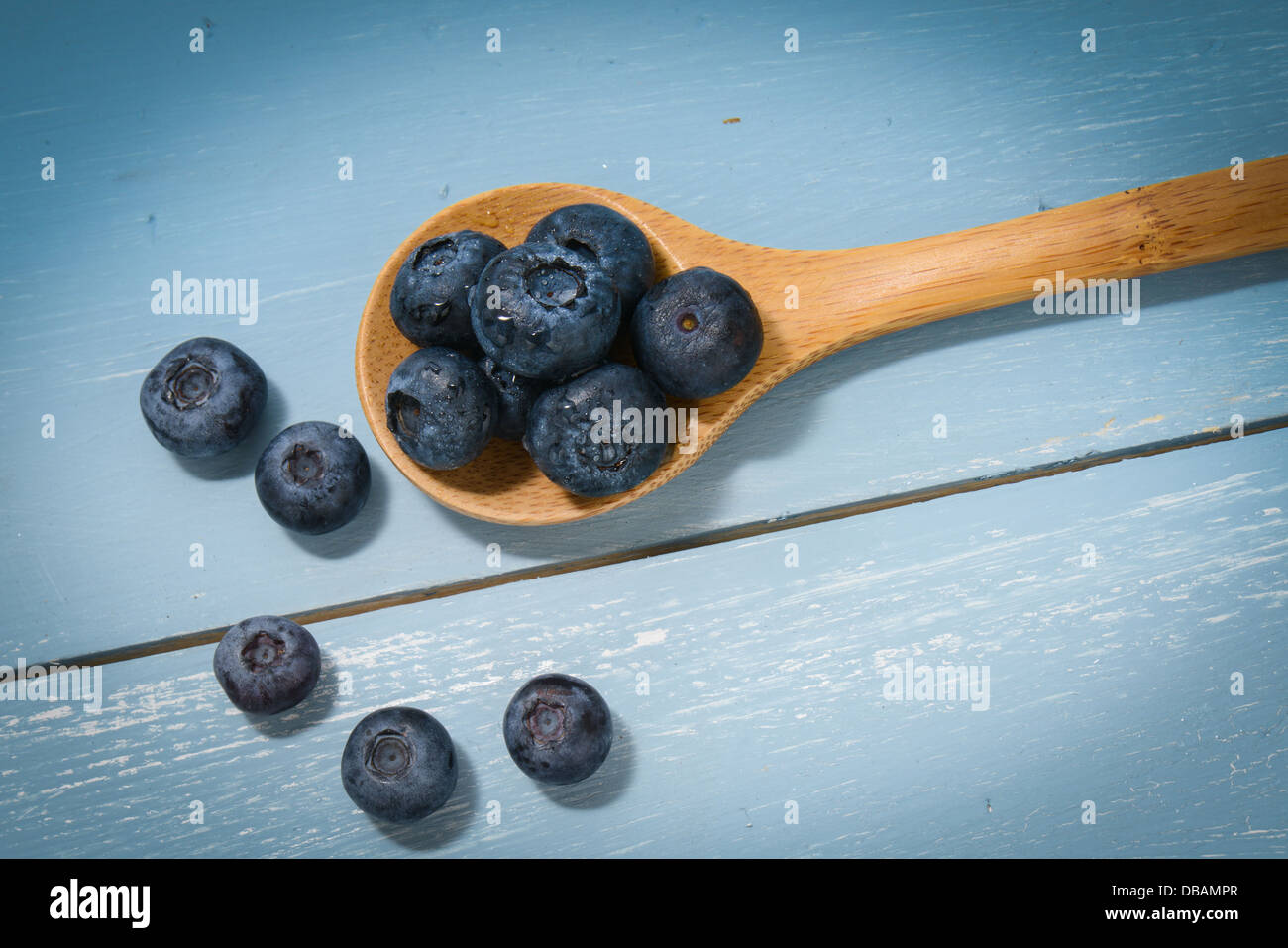 Blueberries on a Wooden Spoon Stock Photo