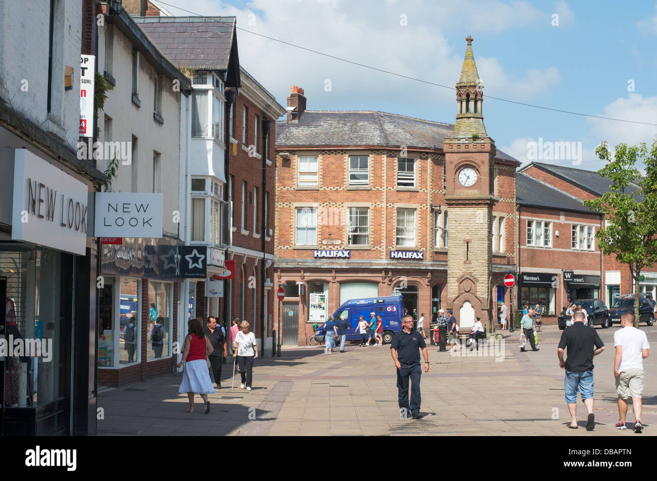 Clock Tower and people walking within the pedestrianised centre of Ormskirk, north west England, UK Stock Photo