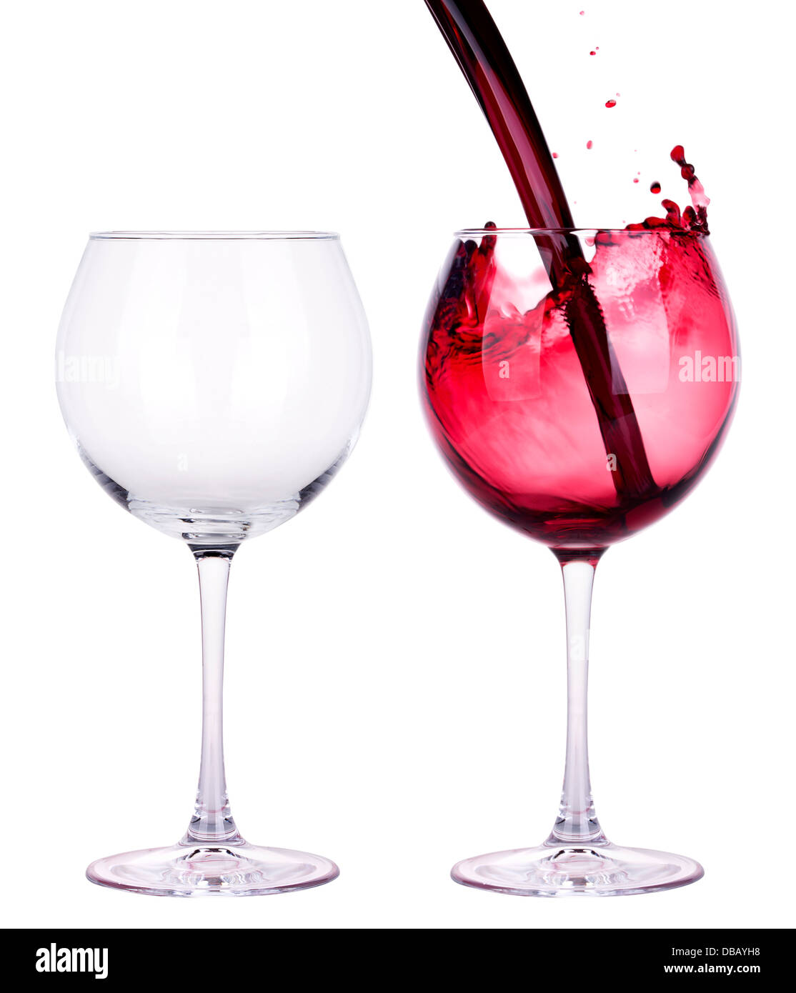 full and empty red wine glass against a white background Stock Photo