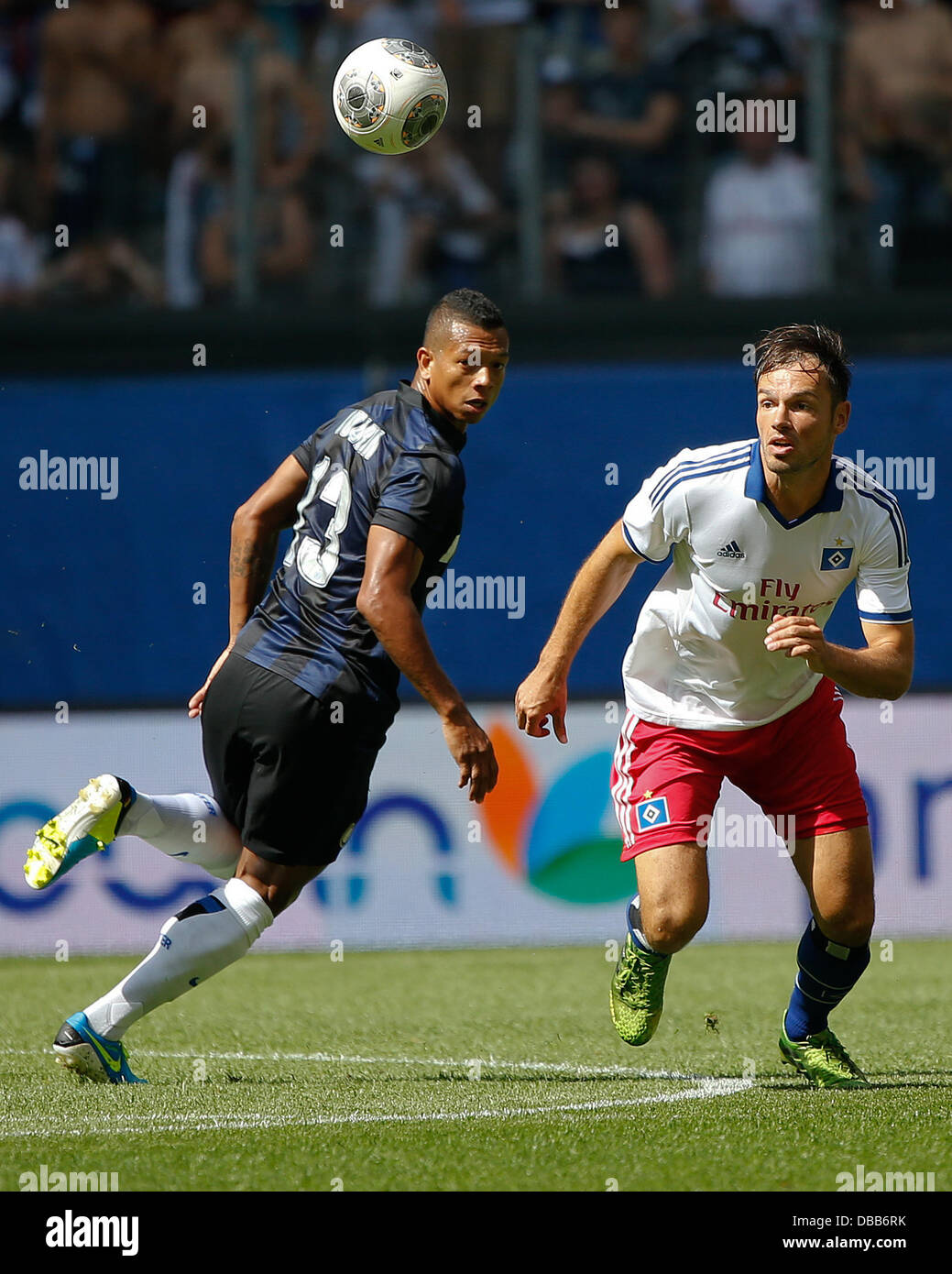 Milan's Fredy Guarin (L) vies for the ball with Hamburg's Heiko Westermann during the test match between Hamburger SV and Inter Milan at Imtech Arena in Hamburg, Germany, 27 July 2013. Photo: AXEL HEIMKEN Stock Photo