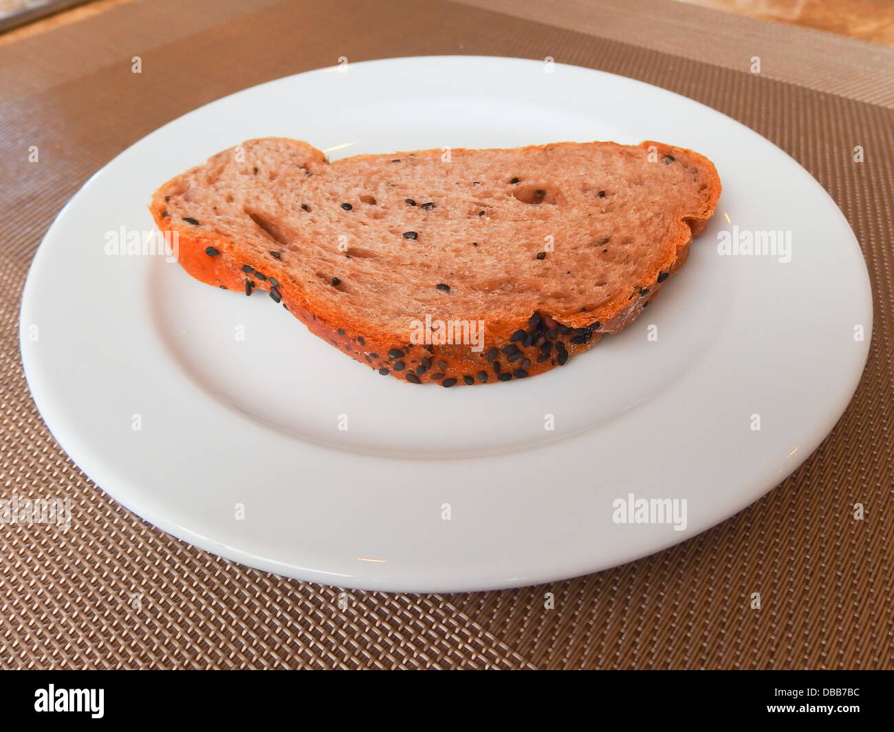 whole grain bread slice on white dish Stock Photo - Alamy