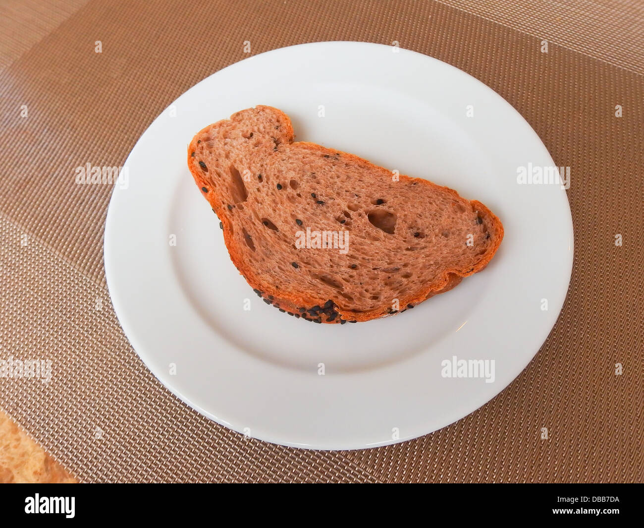 whole grain bread slice on white dish Stock Photo - Alamy