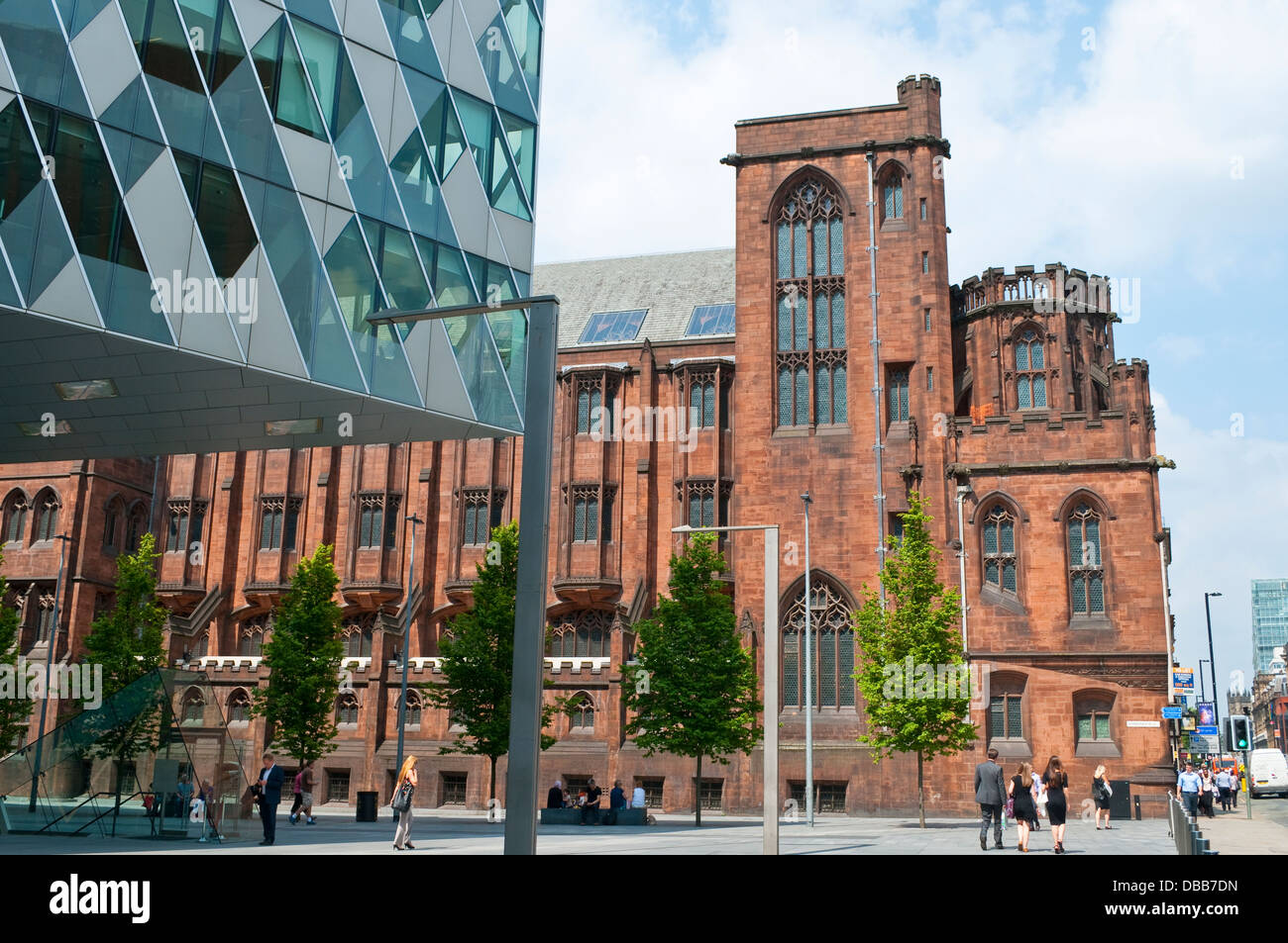 John Rylands Library and Emporio Armani shop, The Avenue, Spinningfields, Manchester, UK Stock Photo