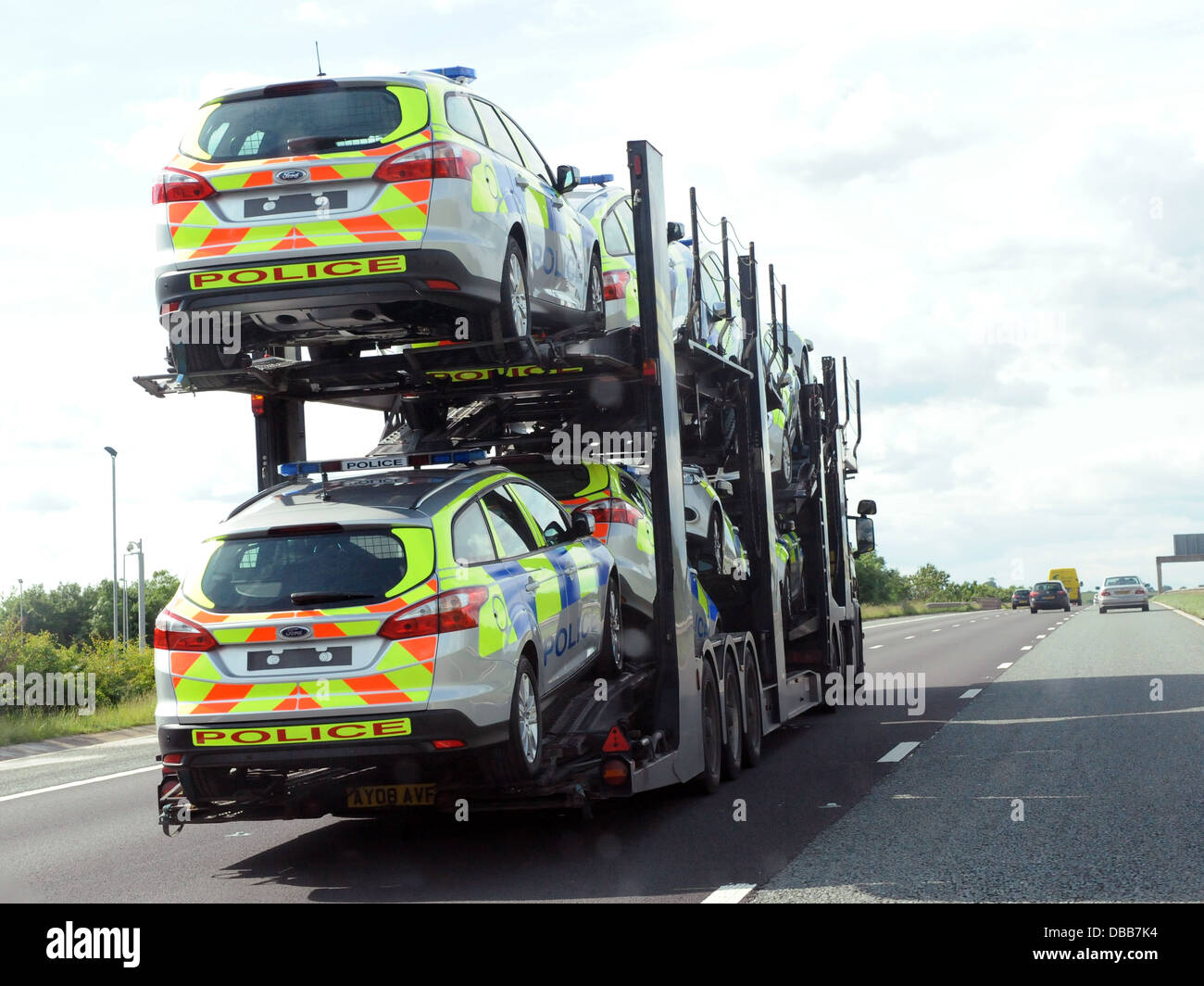 New police cars on a low loader. Stock Photo