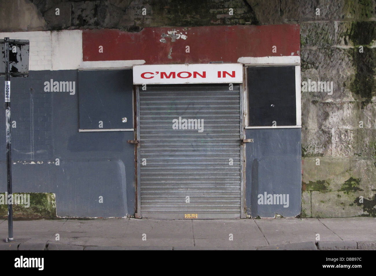 Boarded up cafe named C'Mon In, Clyde Street, Glasgow Stock Photo