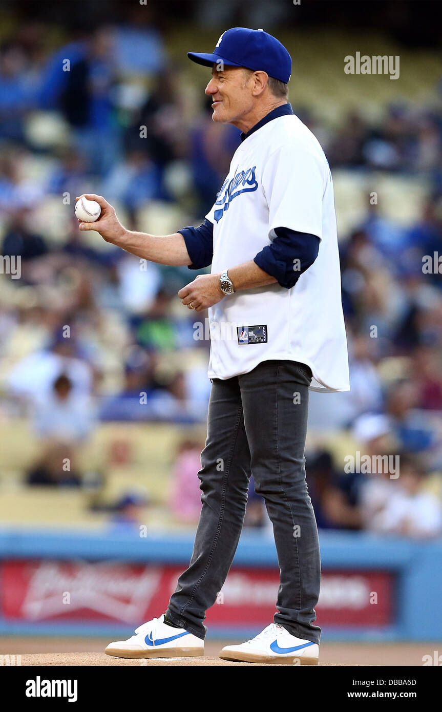 26 July 2013: Actor Bryan Cranston throws out the first pitch during a  Major League Baseball game between the Cincinnati Reds and the Los Angeles  Dodgers at Dodger Stadium in Los Angeles