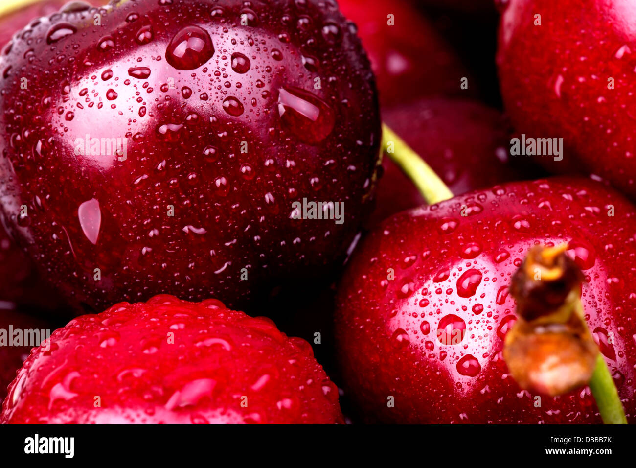 Sweet cherry macro background with water drops Stock Photo - Alamy