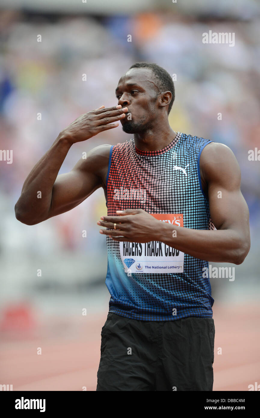 LONDON, UK. Saturday 27th July 2013. Usain Bolt shows his delight after crossing the line to help the Jamaican Racers Track Club win the Men's 4x100m Relay at the 2013 IAAF Diamond League Sainsbury's Anniversary Games held at the Queen Elizabeth Olympic Park Stadium in London. Credit:  Russell Hart/Alamy Live News. Stock Photo