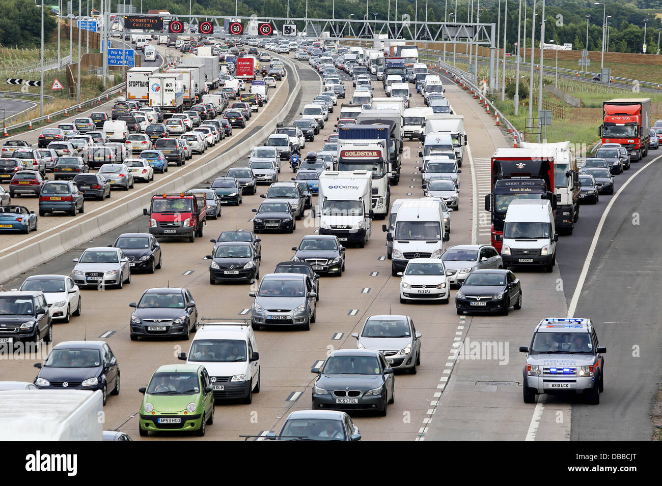 Surrey, UK. 26th July 2013. Photo shows traffic delays on the M25 between junction 9-10 in Surrey. as the summer holiday get away begins. Credit:  Oliver Dixon/Alamy Live News Stock Photo