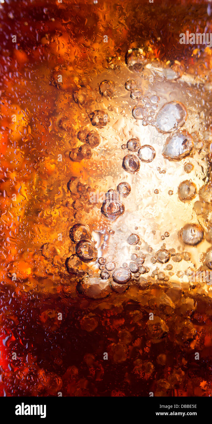 Close up view of the ice cubes in cola background Stock Photo - Alamy