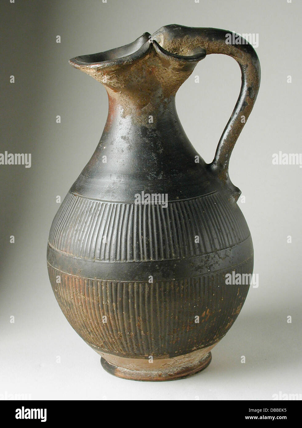 This Greek oinochoe, or wine pitcher, features a unique animal-head ...